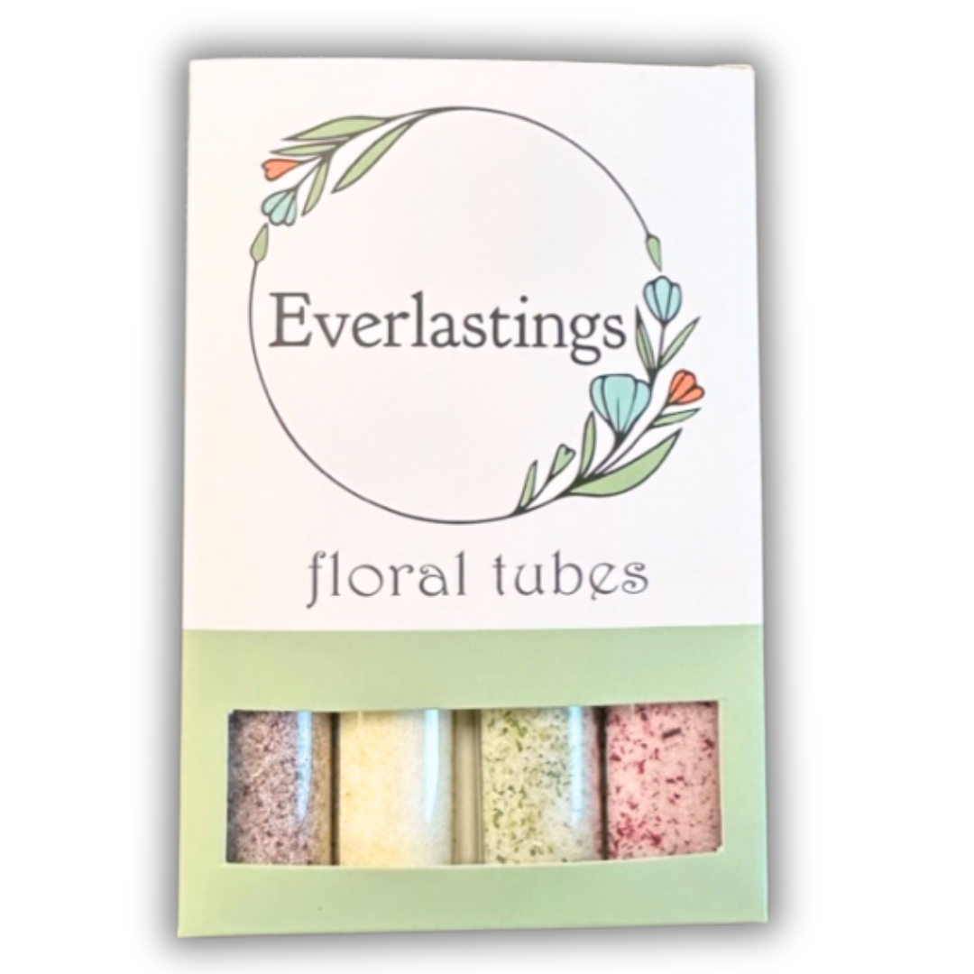 Assorted floral sugar tubes with Everlastings branding, featuring mulberry, bachelor button, mint, and roselle hibiscus sugars.