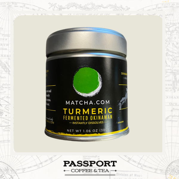 A cylindrical metal canister of Matcha.com Turmeric Fermented Okinawan instant coffee, featuring a black label with a green and white circular logo and yellow text, set against a light beige background with a blueprint-style border and a 'Passport Coffee & Tea' logo at the bottom.